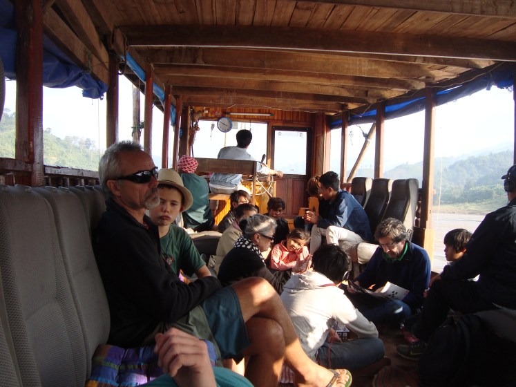 Tourists from Australia and France enjoy the leisurely ride down the Mekong River on the showboat to Luang, Prabang, Laos. 