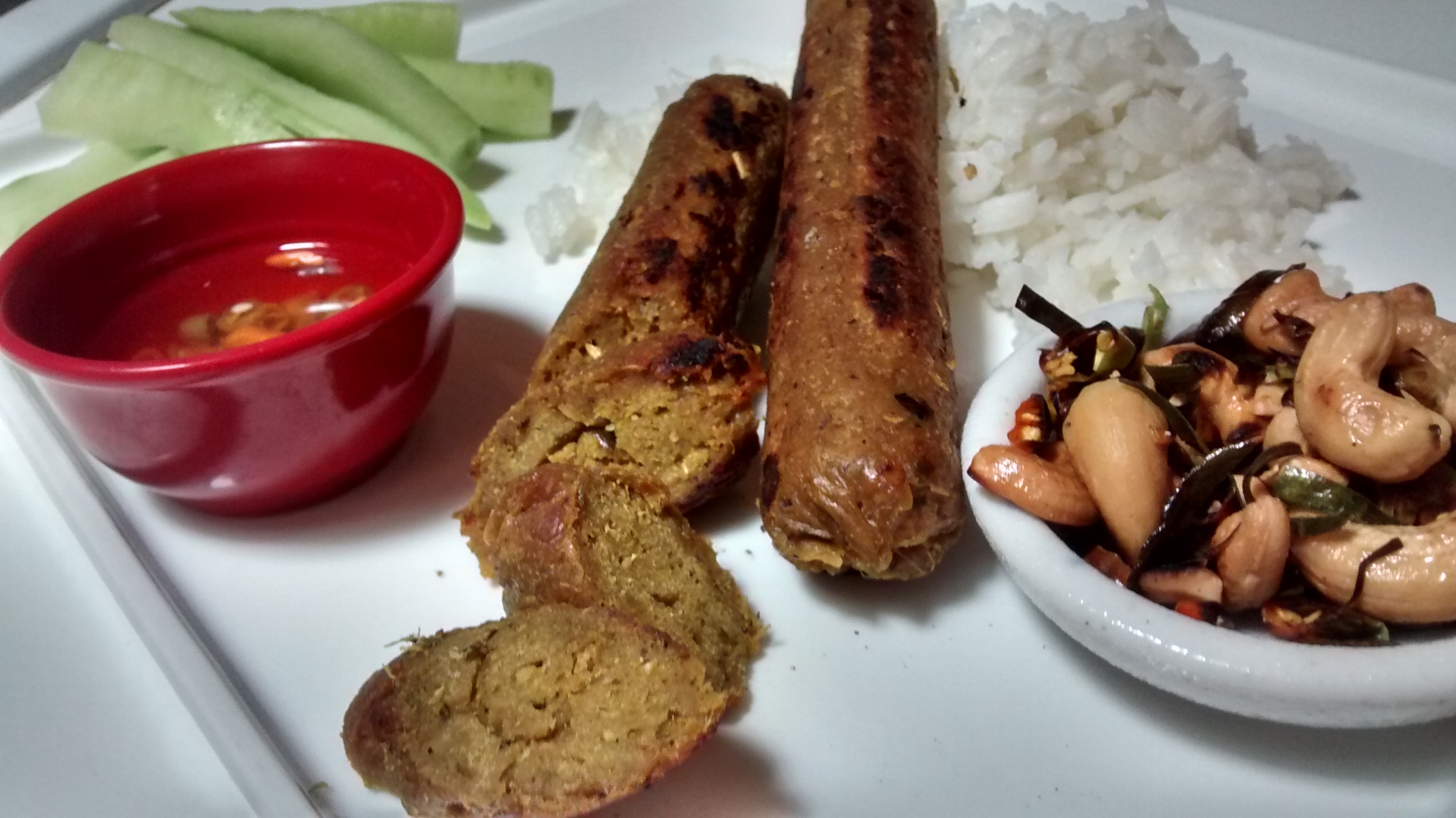plated vegan sai ua, or vegan Chiang Mai sausages