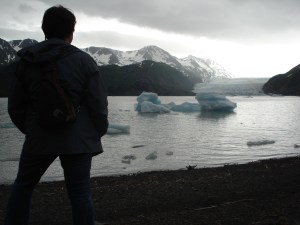 Writer, traveler and blogger Charish Badzinski at glacier near Homer, Alaska.