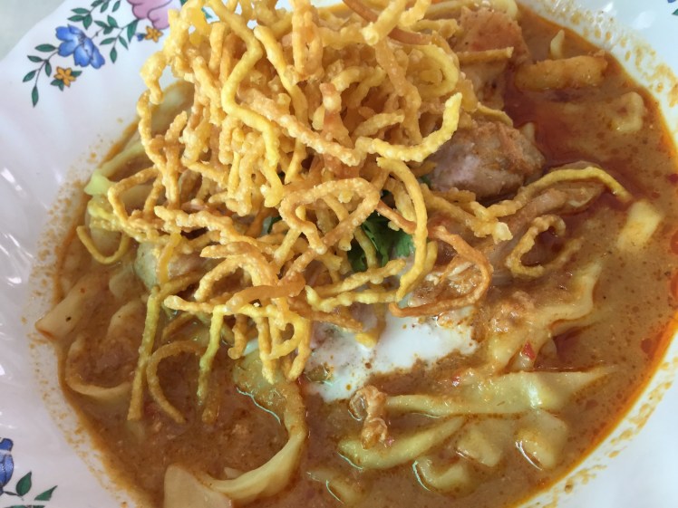 A steaming bowl of delicious khao soi from Chiang Mai, Thailand