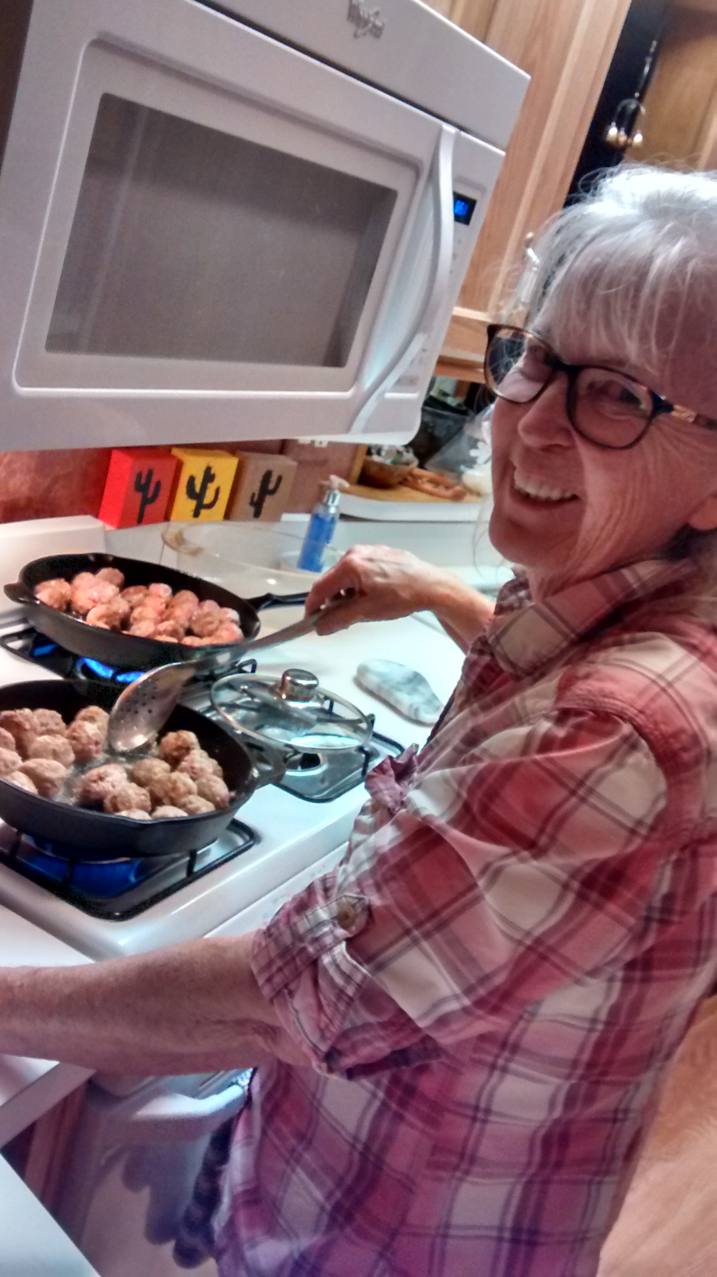 swedish meatballs cooking on stove