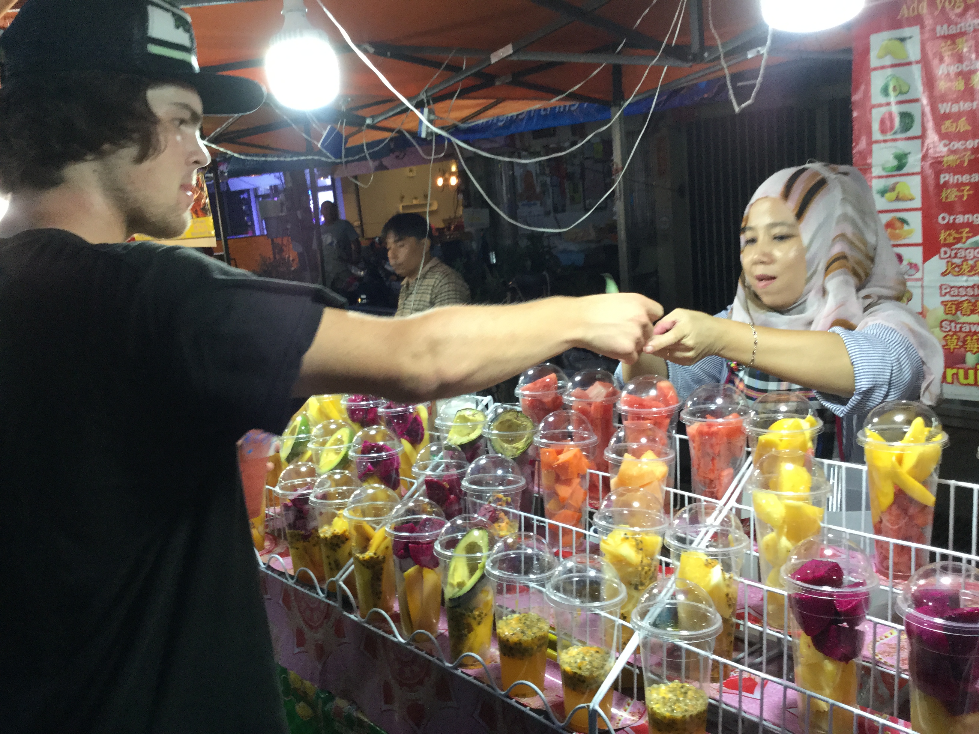 customer paying for fruit shake