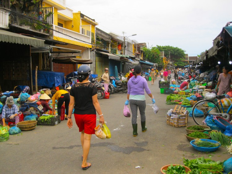 Women shopping for the day's fresh goods at the Central Market in Hoi An, Vietnam. Photo by Charish Badzinski.