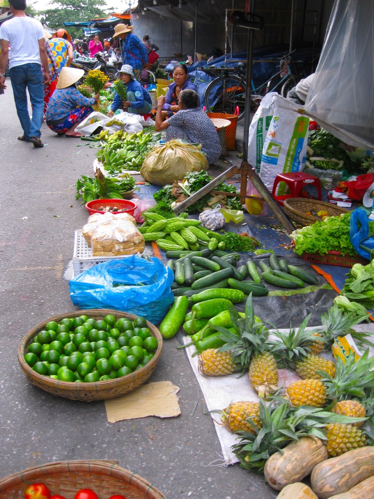 Produce vendors at the Central Market in Hoi An, Vietnam. Photo by Charish Badzinski.