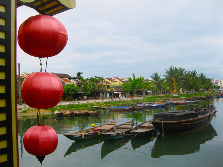 Boats and lanterns at the canal by the old town section of Hoi An. Photo by Charish Badzinski.