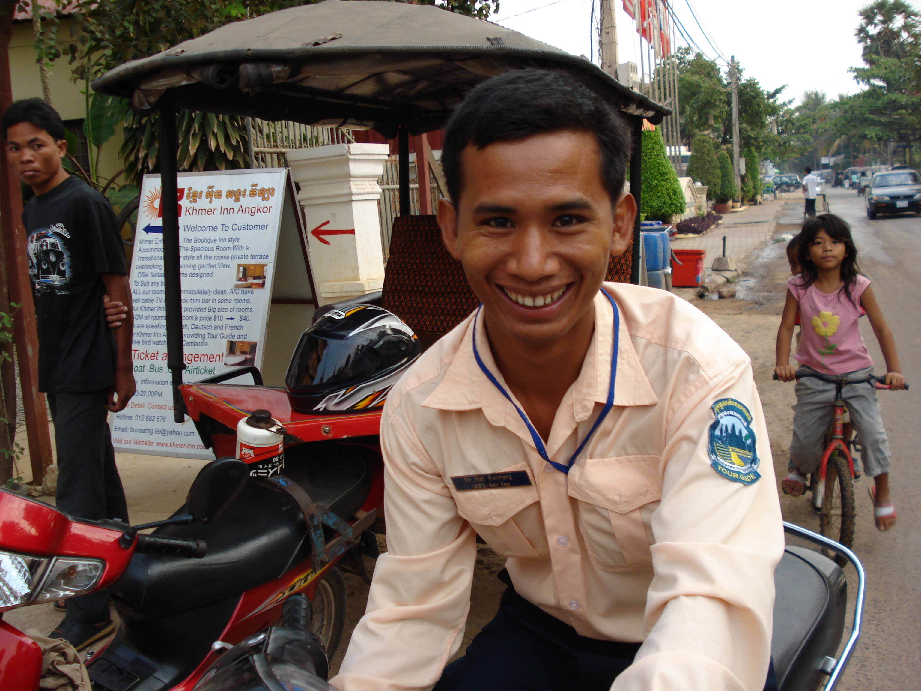 Tuk-tuk driver in Cambodia - budget travel by asking about pricing first