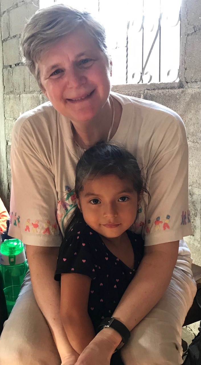 Sister Kathleen Mitchell, FSPA, with a little girl in Honduras