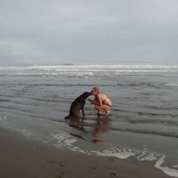 woman and dog in ocean