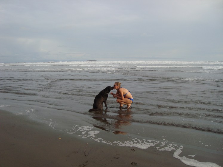 woman and dog in ocean